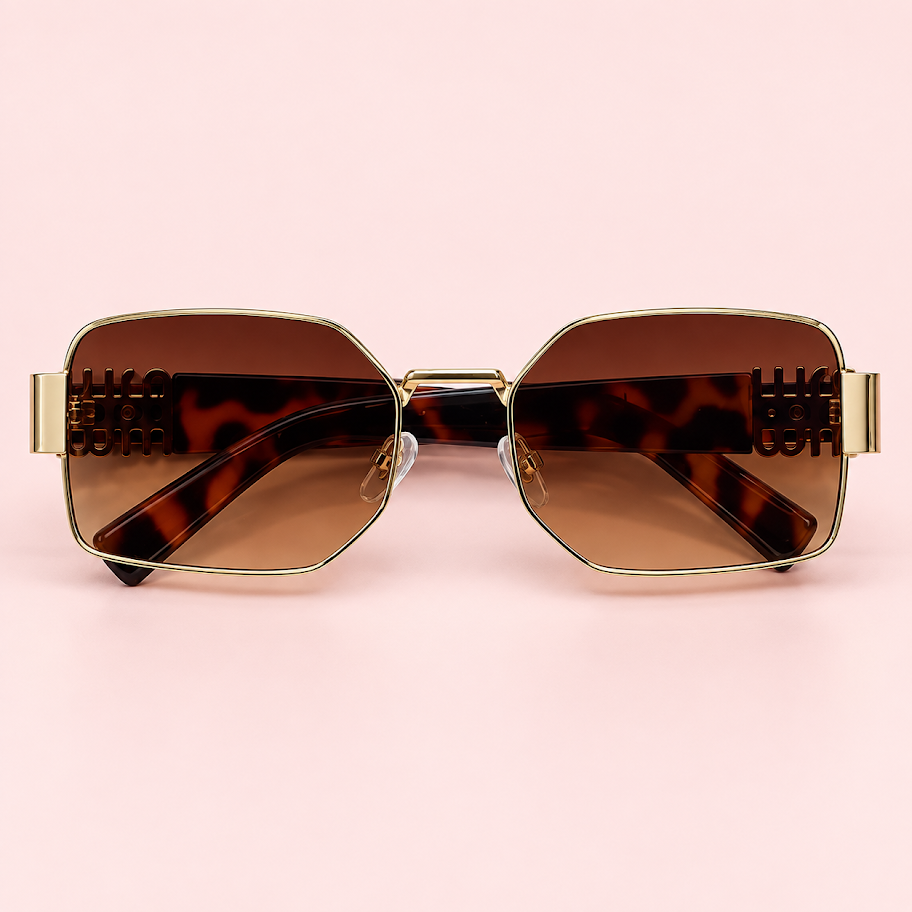 Lente de sol unisex MILA rectangular con armazón dorado, cristales degradé marrón y patillas carey