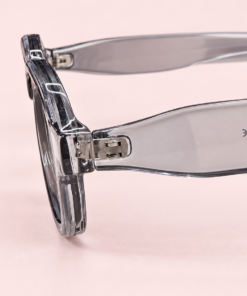 Lente de sol unisex NILO de formato rectangular suavizado con diseño moderno gris transparente de perfil