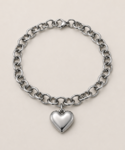 Pulsera de acero quirúrgico con cadena de eslabones y dije decorativo en acabado brillante corazón plateado