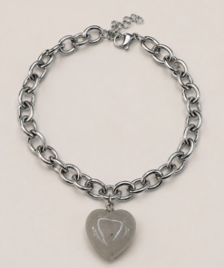 Pulsera de acero quirúrgico con cadena de eslabones y dije decorativo en acabado brillante corazón piedra rosa