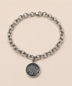 Pulsera de acero quirúrgico con cadena de eslabones y dije decorativo en acabado brillante. Elefante