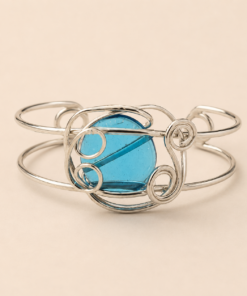Brazalete de alpaca con piedra de color entrelazada celeste