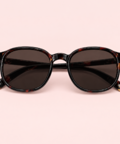 Lente de sol unisex NOA redondeado con armazón carey, cristales oscuros marrones y detalles metálicos dorados